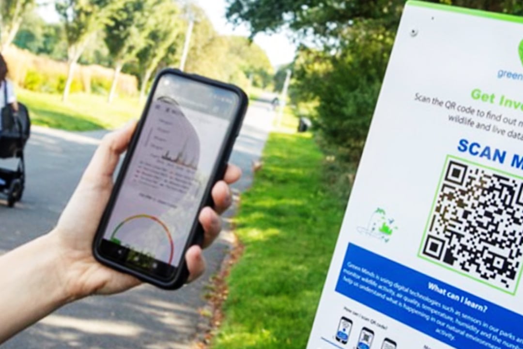 Mobile phone scanning a QR code - rewilding people and places with Green Minds